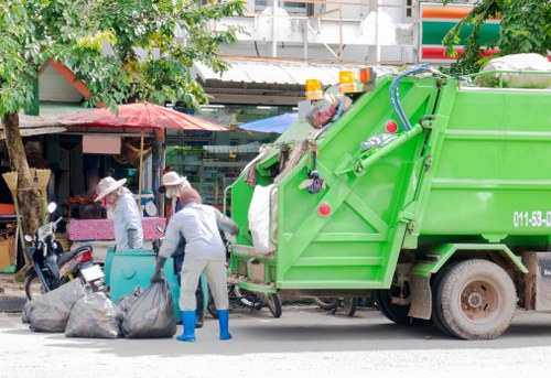Worker preparing equipment for garden clearance